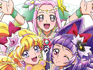 Manga scan of three girls in fluffy, colourful magical-girl outfits.