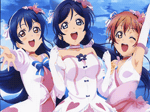 Manga scan of three girls singing at the viewer in pink flowy idol dresses.